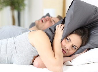 woman bothered by snoring