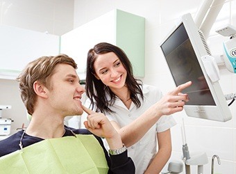 man pointing to smile