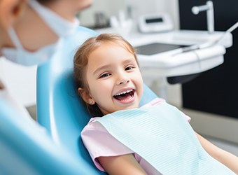 Smiling child in dental treatment chair