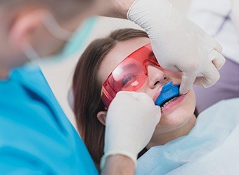 girl getting fluoride treatment