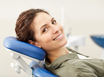 Woman in dental chair during routine appointment.