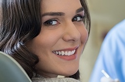 woman smiling over shoulder