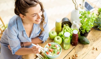 A young woman eating a healthy salad