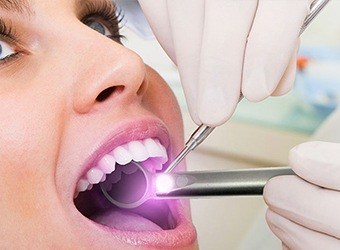 woman getting oral cancer screenings