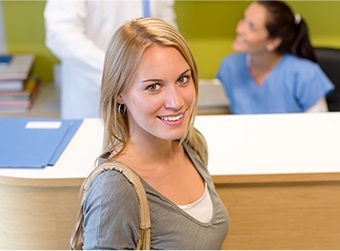 woman smiling up at camera