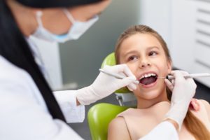 a young girl at the dentist