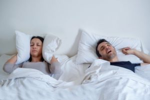 Snoring man with sleep apnea