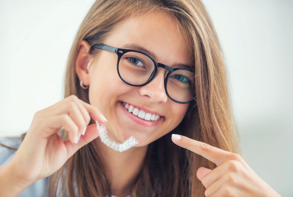 Girl with Invisalign in Prince Albert