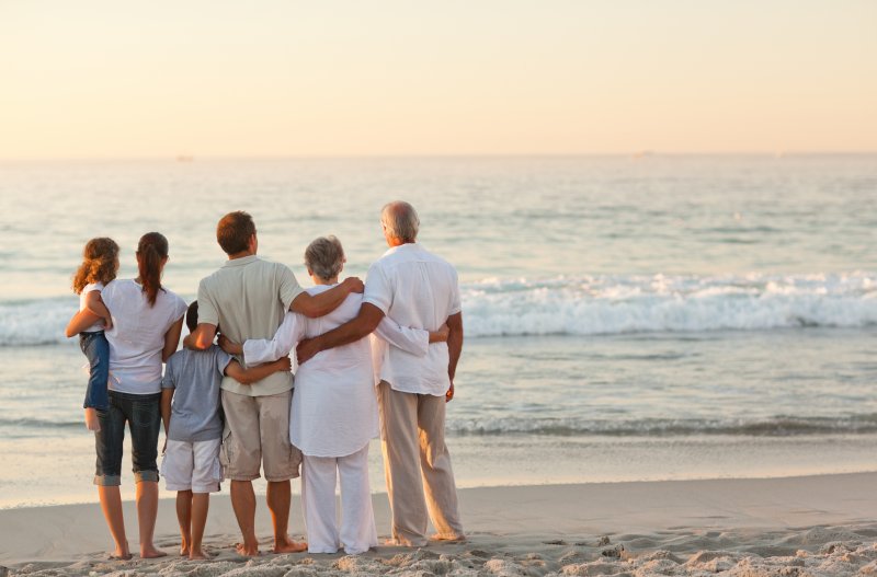 family playing on the beach